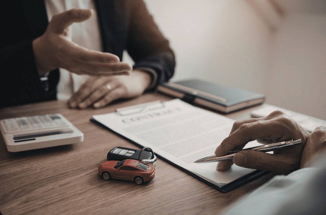 collision center in Brampton handling car insurance paperwork after the collision.